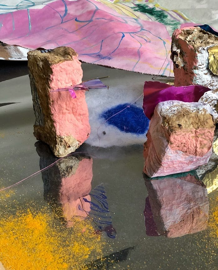 Paula Flores often uses dry pigments in her installations.